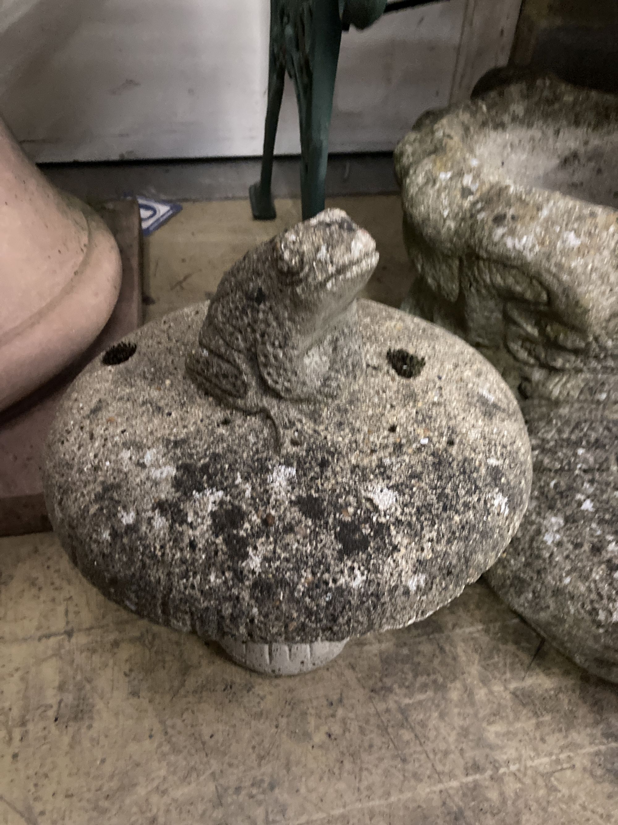 Six reconstituted stone garden ornaments, largest 38cm high